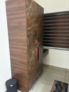 a wooden door in a room with a window at KOTTOOR LODGE Parakode in Adūr