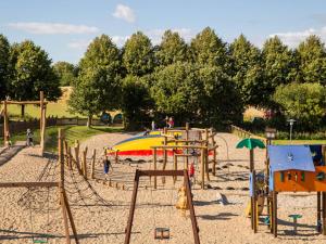 a playground with a slide in a park at DCU-Camping Kulhuse in Kulhuse