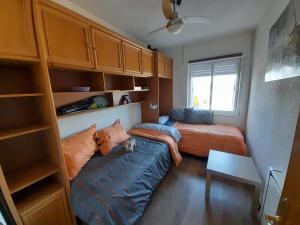 a bedroom with two beds and a couch in it at Montepino in Maello