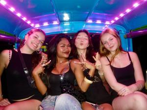 a group of four girls sitting in a club at Zostel Phuket, Patong Beach Hostel in Patong Beach