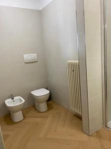 a bathroom with a toilet and a sink at Casa Fenice in Romano D'Ezzelino +8 photos
