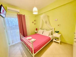 a small bedroom with a bed and a window at ZEN, Oneiropagida, Aegina in Vathí