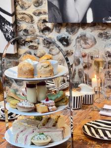 a three tiered display of different types of food at NoTwenty9 Bar and Restaurant in Burnham Market