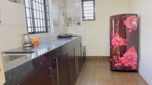 a kitchen with a sink and a refrigerator at Sea shells on the seashore in Cocoanut Island +57 photos