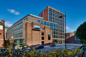 a large brick building on a city street at citizenM Dublin St Patrick's in Dublin