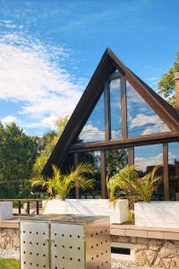 a building with a roof with windows at Spicc house in Csopak