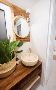 a bathroom with a sink and a mirror at Spicc house in Csopak
