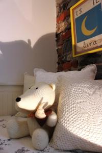 A bed or beds in a room at Le Dame Della Cortesella B&B