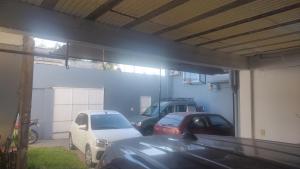 two cars parked in a garage with a blue wall at rocky in Concordia