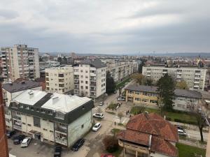 an aerial view of a city with buildings and cars at Apartman Novak Prijedor in Prijedor