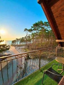 a balcony with a view of the ocean at „Amber” Pokoje z widokiem na morze in Krynica Morska