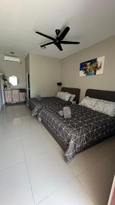 a bedroom with a bed and a ceiling fan at Homestay Babah - Private Chalet in Malacca +8 photos
