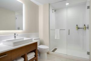 a bathroom with a toilet and a sink and a shower at Element by Marriott Springfield South in Springfield +26 photos