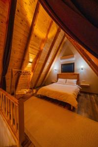 a bedroom with a bed in a attic at Green date bungalow in Sapanca