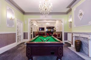 a room with a pool table and a chandelier at The Sonora Park Contactless Hotel by BET stays in Blackpool