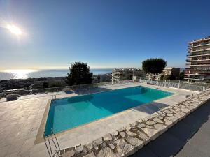 a swimming pool on top of a building at Studio in a luxury community in Nice