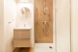 a bathroom with a shower and a sink at Klimatyzowane Apartamenty Miedź i Miód in Bytom Odrzański +139 photos