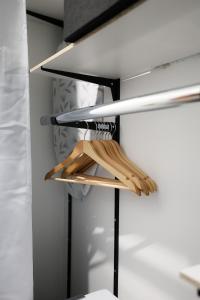 a closet with wooden utensils on a shelf at Le Quai Verrière in Belfort