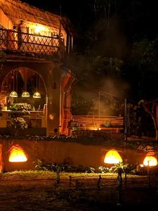 a train yard at night with lights on at Taiga Forest Mountain Tree house in Wayanad