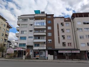 a tall building on the corner of a street at Hotel Poli in Blagoevgrad