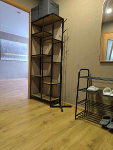 a room with a book shelf next to a door at Apartment GLORIA in Narva-Jõesuu