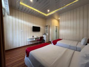 Grand Tamaro Hotel tesisinde bir televizyon ve/veya eğlence merkezi