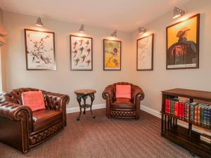 a waiting room with two chairs and a table at Cloneytrace Mines in Ballymena