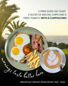 a plate of food with eggs and bacon and a cup of coffee at Sunbirds Bed & Breakfast in Southbroom +24 photos