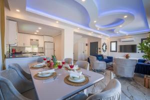 a kitchen and living room with a table and chairs at Villa Huzur in Fethiye