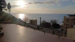 a view of the ocean from a balcony at Suite Enea San Rocco in Sperlonga