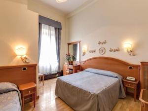 Voodi või voodid majutusasutuse Hotel Labelle toas