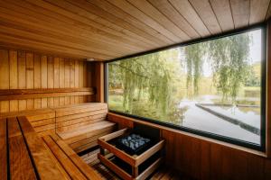 an inside view of a sauna with a large window at Crafted at Powdermills in Battle