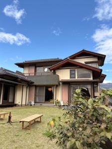 a house with a picnic table in front of it at 宿杏 Yado Ann in Kofu
