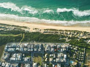 an aerial view of a beach with houses and the ocean at Pousada Do Capitão in Florianópolis