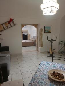 a living room with a plate of food on a table at Da Adriana NETUM in Noto