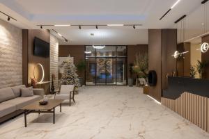 a lobby with a christmas tree and a couch at Apartmani Aurora Zlatibor in Zlatibor