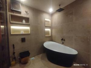 a bathroom with a tub and a sink at Rafifi pyramids inn view in Cairo +74 photos
