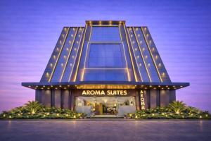 a rendering of the amazon buildings at night at Hotel Aroma Suites Delhi - With Free Airport Drop in New Delhi