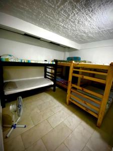 a room with two bunk beds and a toilet at Palmeras 2 in Manizales +5 photos