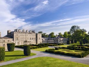 an exterior view of a castle with a garden at Carton House A Fairmont Managed hotel in Maynooth
