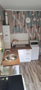 a kitchen with a sink and a counter top at Anita in Budapest +37 photos