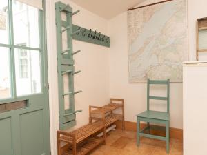 a room with a green door and a chair at Steading Cottage - Ukc5957 in Port Appin