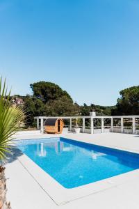 a swimming pool on the roof of a house at Casa Blanca in Dosríus +59 photos