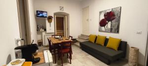 a living room with a couch and a table at Adalù apartments in Conversano