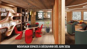 a library with red chairs and a table and bookshelves at ibis Styles Lyon Sud Vienne in Chasse-sur-Rhône