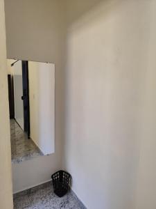 a mirror on a wall in a room at Soninho Bão in Cunha