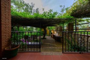 an entrance to a garden with an iron gate at Cortijo Zalamea in Zalamea la Real
