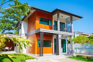a house with an orange at Chaba Pool Villa Khao Lak in Khao Lak