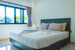 a bedroom with a large bed with a large window at Chaba Pool Villa Khao Lak in Khao Lak +82 photos