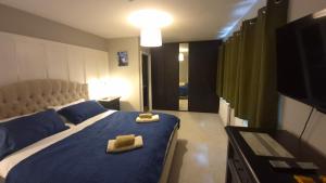 a bedroom with a bed with two towels on it at Brady Accommodation in Monaghan